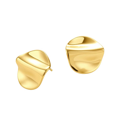 Close-up of organic gold-plated sterling silver stud earrings with flowing sculptural design and curved cut-outs