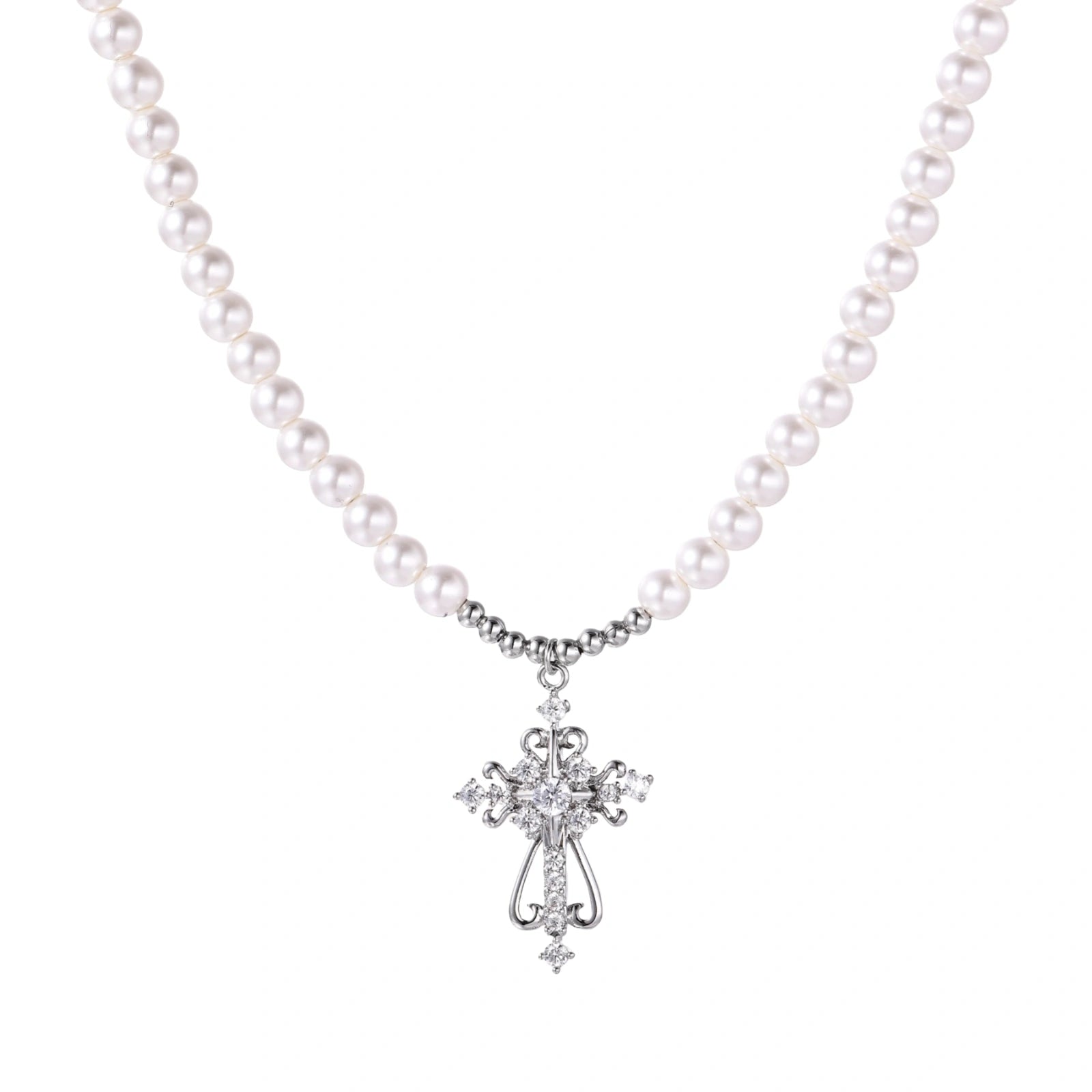 White pearl necklace with ornate silver cross pendant featuring zirconia crystals on cream background.